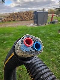 Cut end of Cozy Wrap 3 line showing the PEX inside