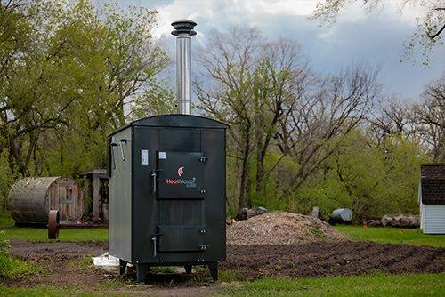 A new HeatMaster G Series gasification boiler set up in a backyard